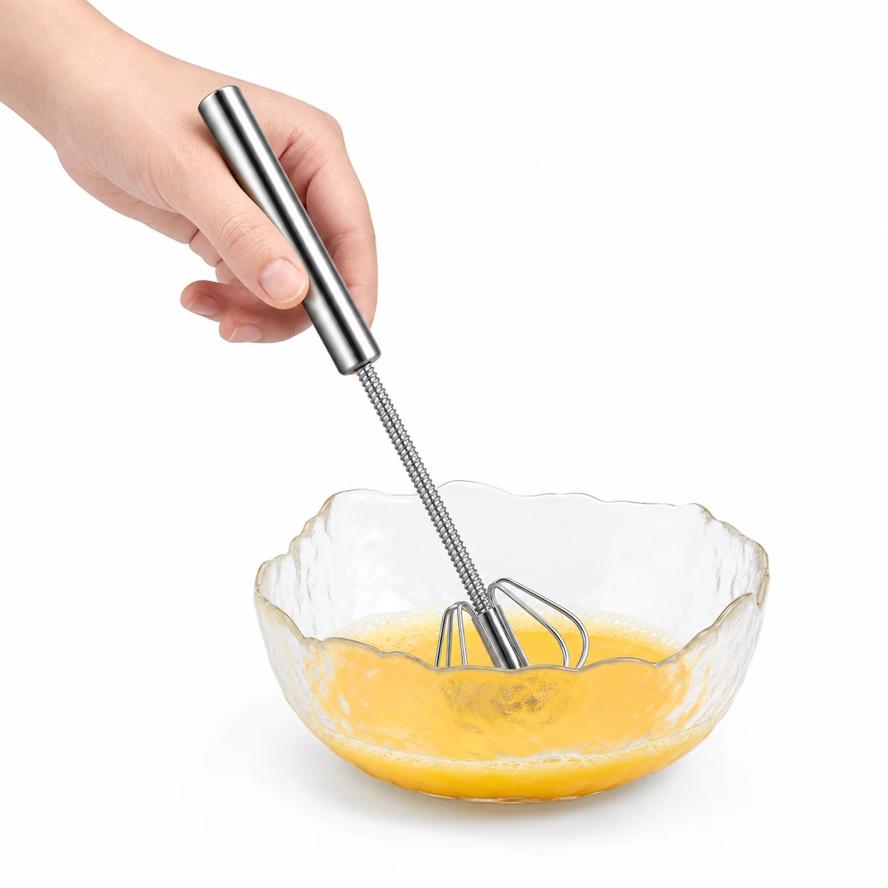 Manual stainless steel whisk mixing beaten egg