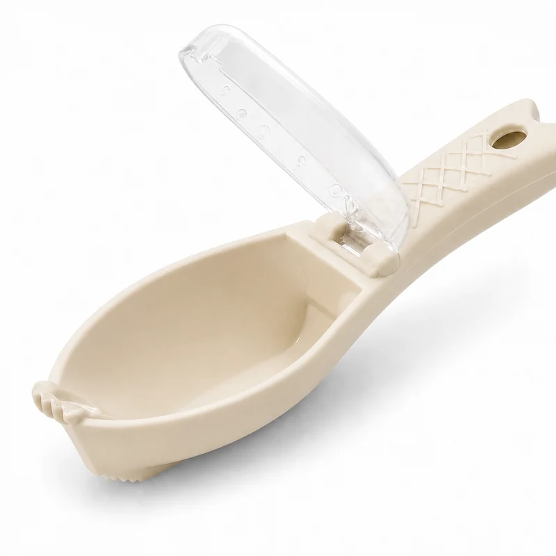Beige fish scaler with scale catching scoop and clear cover