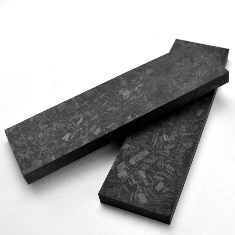 Carbon fiber handle material slabs showing face texture and edge thickness