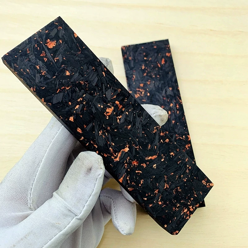 Carbon fiber handle material slabs with copper-colored flecks