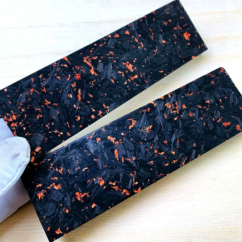 Carbon fiber handle material shown as paired forged composite slabs