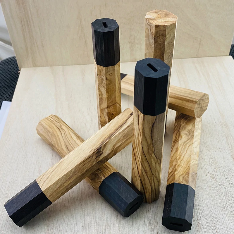 Octagonal wood Japanese knife handles showing pre-cut tang slots