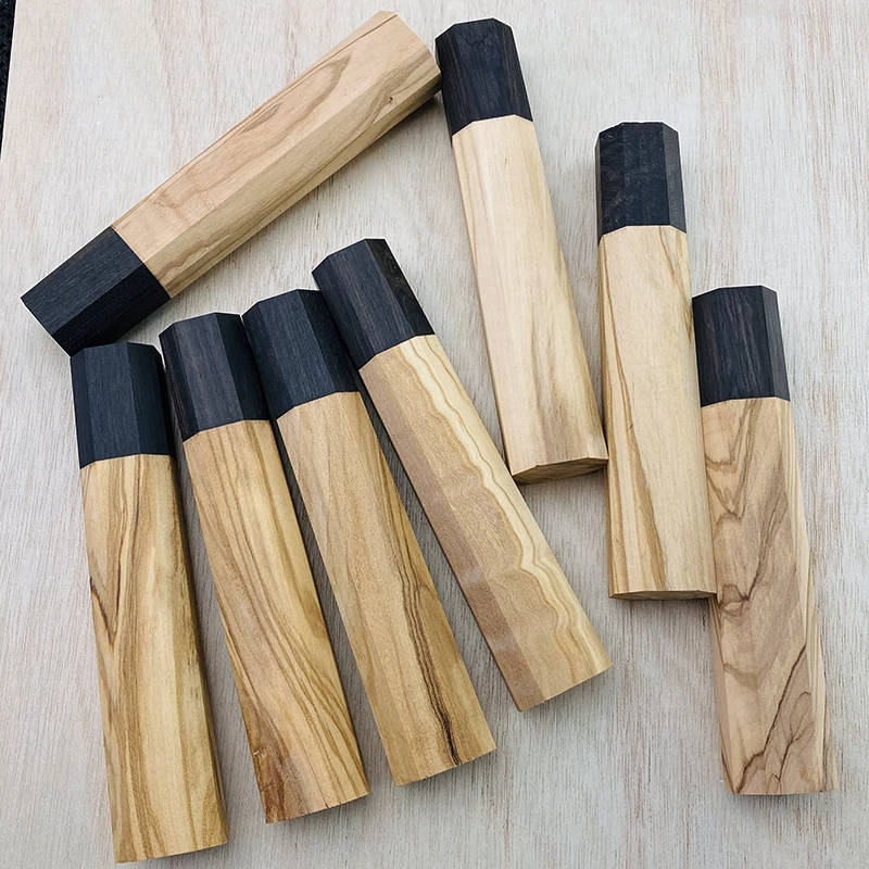 Natural olive wood grain variations across octagonal Japanese knife handles