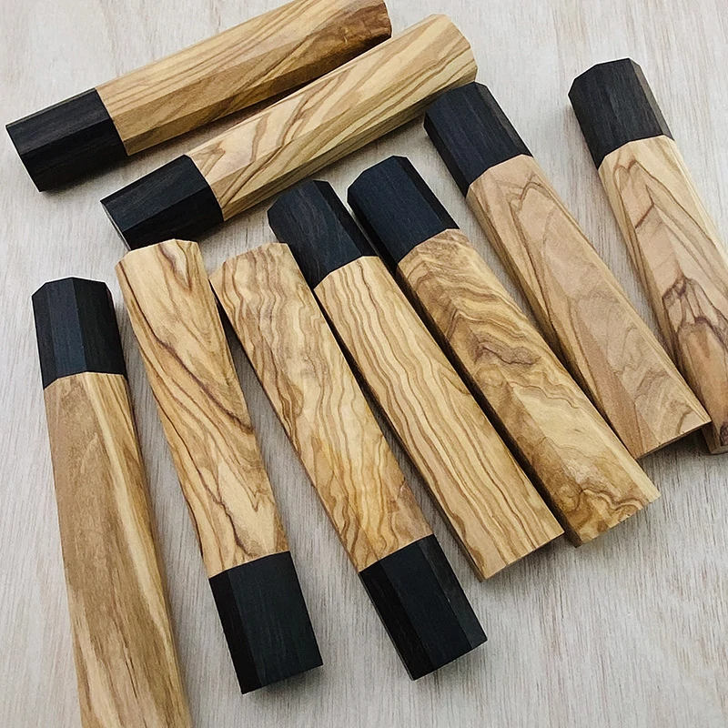 Assorted octagonal olive wood knife handles with natural grain patterns