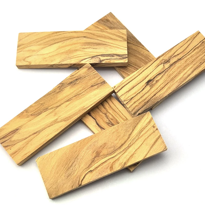Selection of olive wood knife handle blanks with natural grain variation