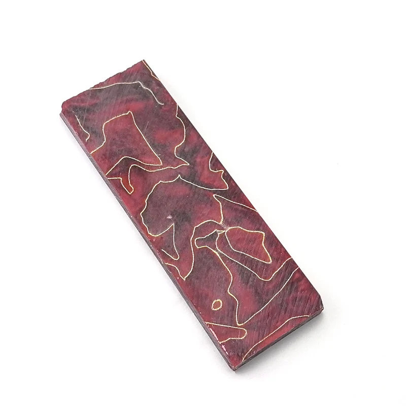 Red copper mesh resin knife handle blank on a white background