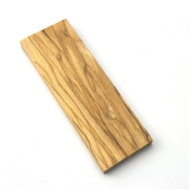 Single olive wood knife handle blank on a clean white background