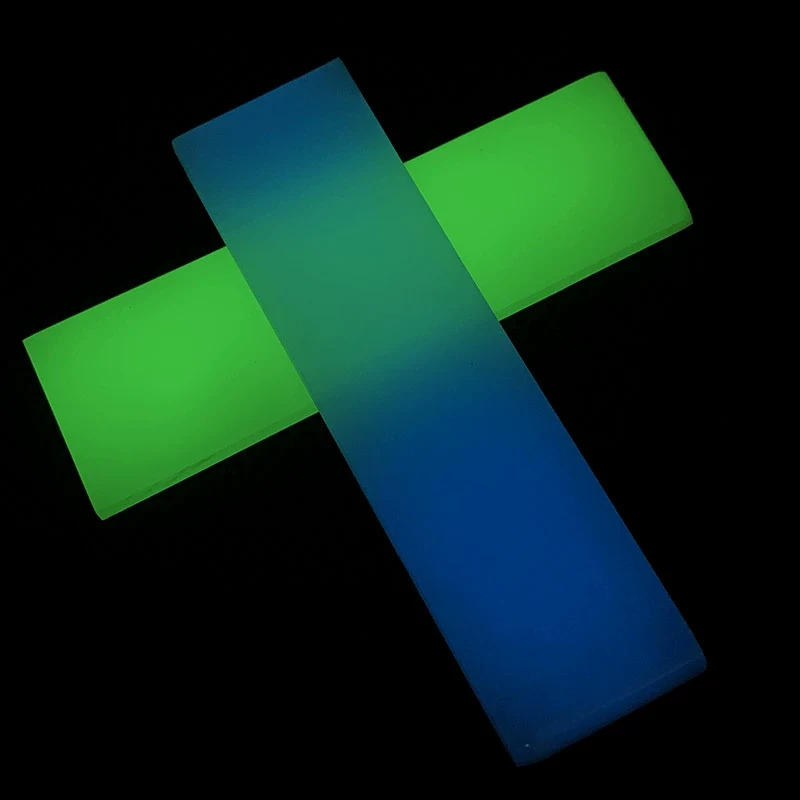 glow resin knife handle scales glowing green and blue in the dark